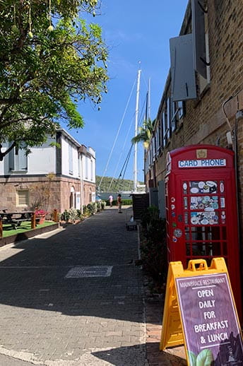 A red phone box and sunny street, Antigua. 